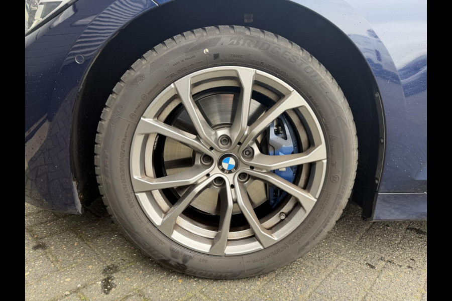 BMW 3 Serie Touring 320i High Executive M-Sport | Panoramadak | Camera | Head-Up Display | DAB |