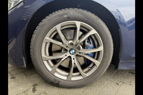 BMW 3 Serie Touring 320i High Executive M-Sport | Panoramadak | Camera | Head-Up Display | DAB |