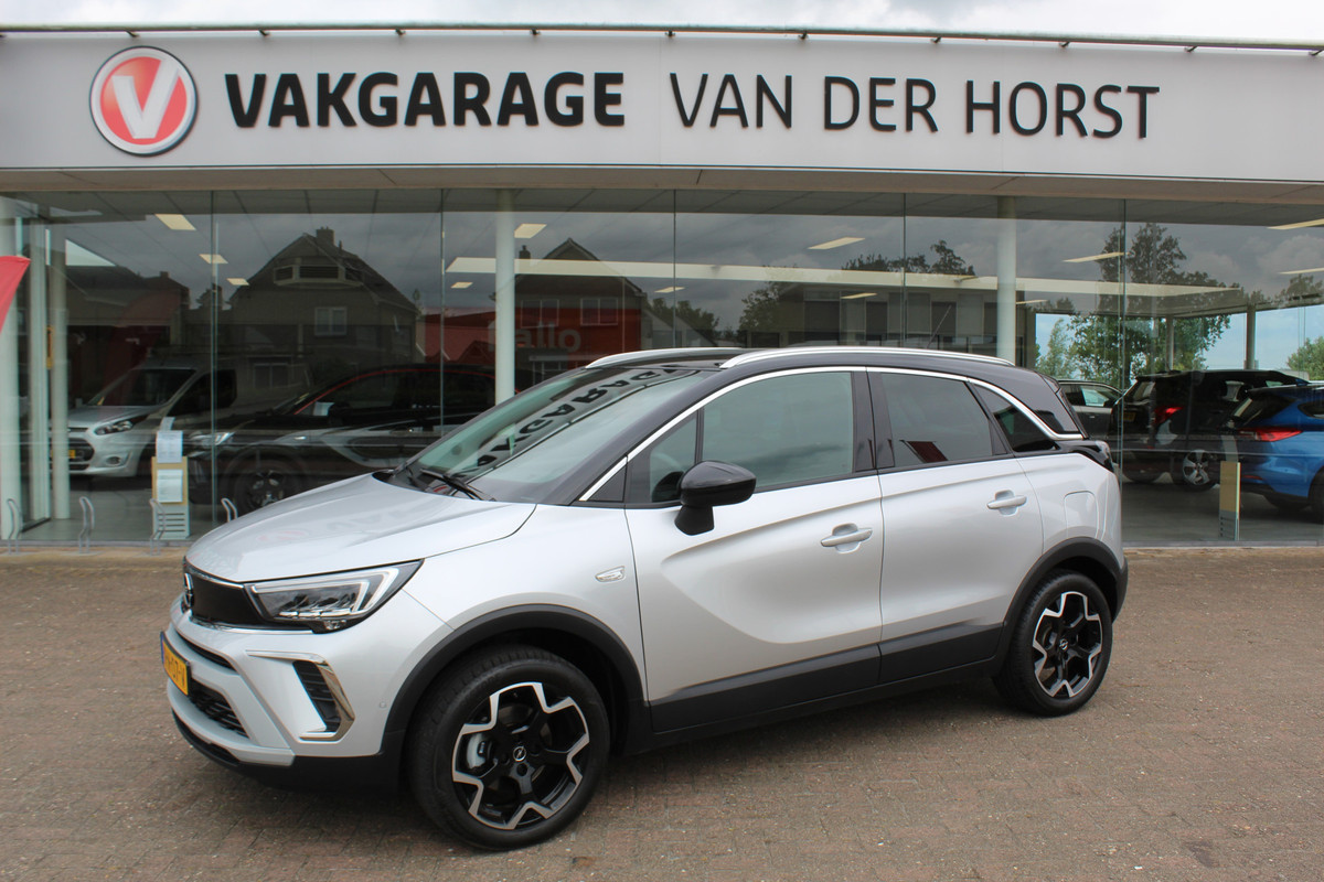 Opel Crossland 1.2-110pk Turbo 'Elegance'. Mooie en luxe hoogzitter met weinig km's ! Volautm. airco dual, cruise control, camera, comfortstoelen, metallic lak,  LM wielen, navigatie, telefoonvoorb., lane- en side assist, parkeersensoren v+a,  LED verlichting  etc.