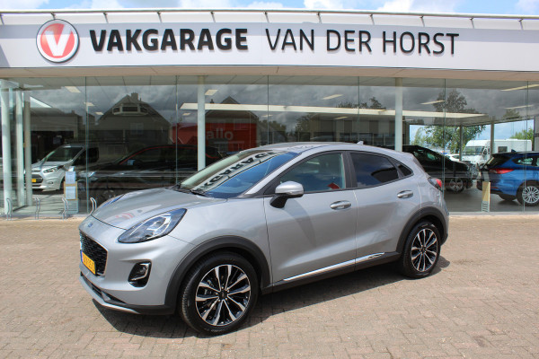Ford Puma 1.0-125pk EcoBoost Mild-Hybrid Titanium X. Garantie t/m 07-03-2028 ! Slechts 7.400km ! Cruise cntrl, climate cntrl, stoel-, stuur- en voorraamverw., draadloos opladen telefoon, trekhaak afneembaar, navigatie, telefoonvoorb., LM wielen, B&O soundsyst., digitaal dashboard etc.