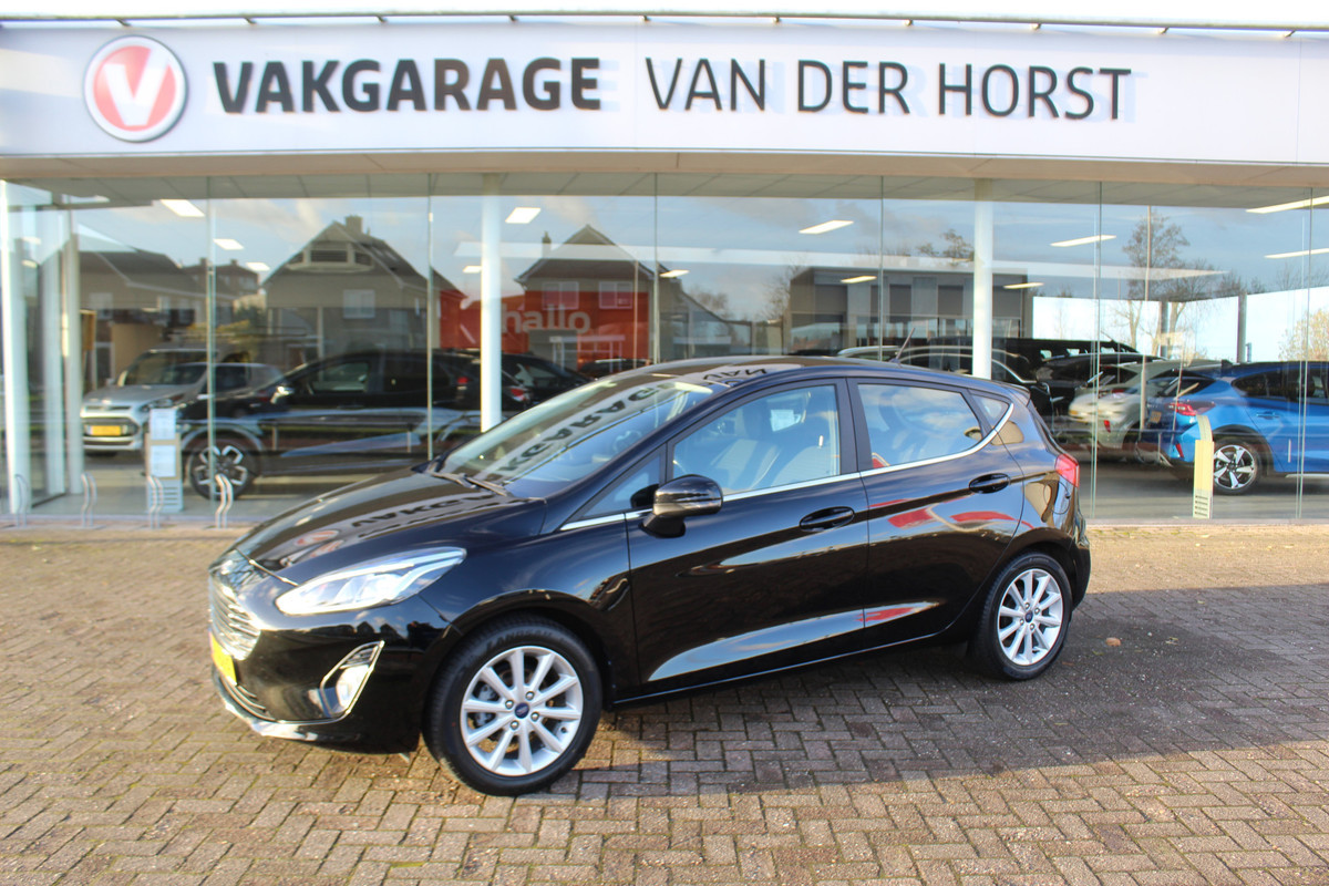 Ford Fiesta 1.0-100pk EcoBoost Titanium 5deurs Mooie en zuinige Ford Fiesta in de luxe Titanium uitvoering. Climate control , Cruise control , Navigatie , Bluetooth