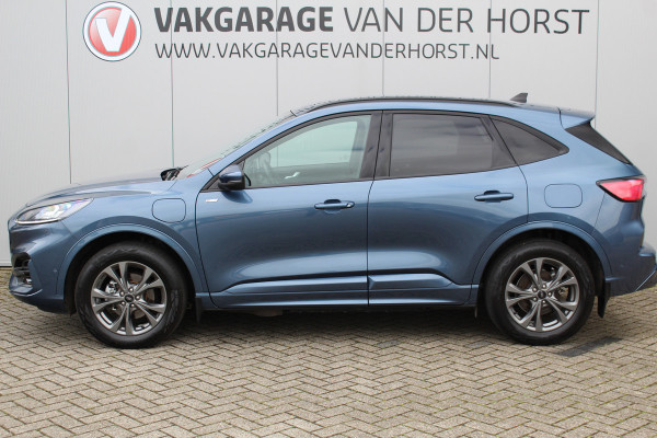 Ford Kuga 2.5-225 pk PHEV ST-Line X. Hybride rijden voor een reëel bedrag ! Slechts 31.500km ! Stoel-, stuur-, achterbank en voorraamverw., B&O soundsyst., Adaptieve Cruise Control, Climate Control dual, Camera v+a, Navigatie, Telefoonvoorb., Side- en lane assist etc.