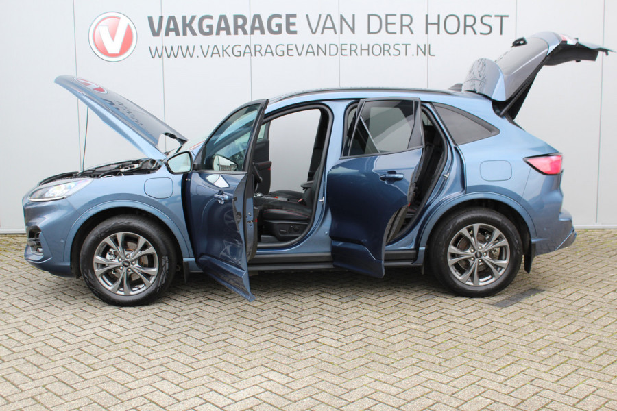 Ford Kuga 2.5-225 pk PHEV ST-Line X. Hybride rijden voor een reëel bedrag ! Slechts 31.500km ! Stoel-, stuur-, achterbank en voorraamverw., B&O soundsyst., Adaptieve Cruise Control, Climate Control dual, Camera v+a, Navigatie, Telefoonvoorb., Side- en lane assist etc.