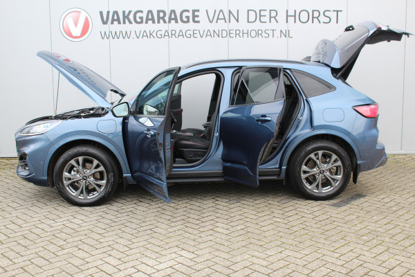 Ford Kuga 2.5-225 pk PHEV ST-Line X. Hybride rijden voor een reëel bedrag ! Slechts 31.500km ! Stoel-, stuur-, achterbank en voorraamverw., B&O soundsyst., Adaptieve Cruise Control, Climate Control dual, Camera v+a, Navigatie, Telefoonvoorb., Side- en lane assist etc.