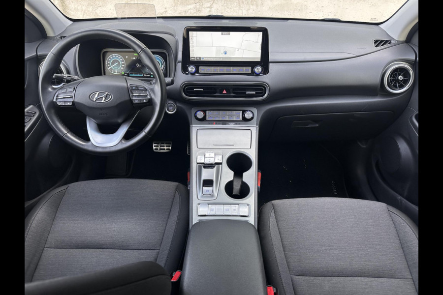 Hyundai Kona EV Fashion 64 kWh | SOH: 96,3%| Facelift | 3 Fase | Warmtepomp | Navi | HUD | Adaptive CC | Camera |