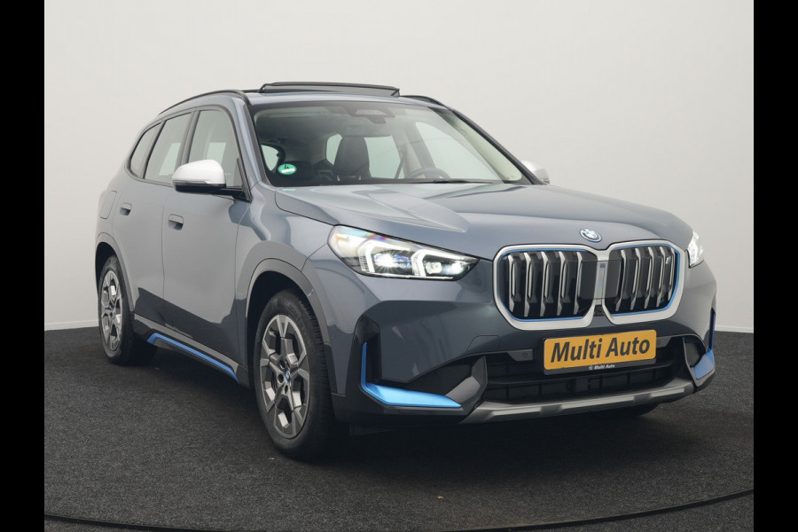 BMW iX1 xDrive30 Launch Edition 313pk Dealer O.H | Panodak | Adaptive Cruise | 360 Camera | Lederen Comfortzetels Massage & Memory | Head Up | Harman Kardon | Keyless |