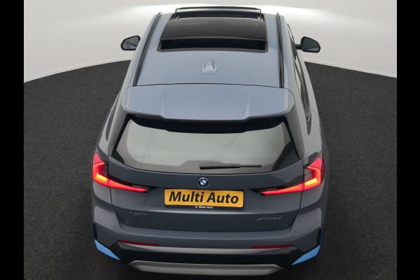 BMW iX1 xDrive30 Launch Edition 313pk Dealer O.H | Panodak | Adaptive Cruise | 360 Camera | Lederen Comfortzetels Massage & Memory | Head Up | Harman Kardon | Keyless |