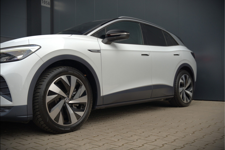 Volkswagen ID.4 First 77 kWh | Stoelverwarming | Stuurverwarming | Trekhaak | Adaptive Cruise Control | Navigatie | Apple Carplay | Keyless | Camera | Parkeersensoren | NAP | BTW | Dealer Onderhouden