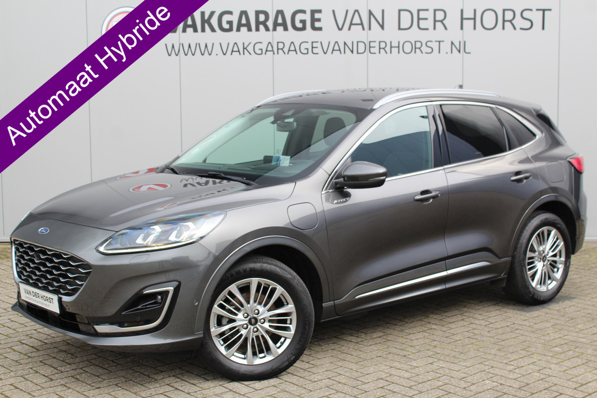 Ford Kuga 2.5-225pk PHEV 'Vignale' Plug-in Hybrid Automaat. Luxe hybride rijden voor een reëel bedrag ! Trekhaak, Adaptieve Cruise Cntrl, Climate Cntrl, Side- en lane assist, Head-Up display, Winter Pack, Driver Ass. Pack, Camera, Elektr. achterklep etc.
