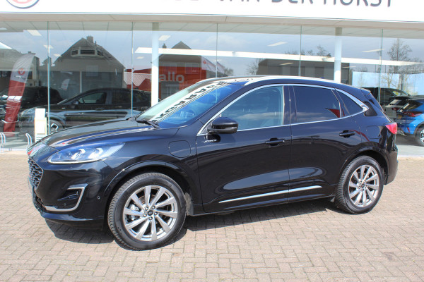 Ford Kuga 2.5-225pk PHEV 'Vignale' Plug-in Hybrid Automaat. Luxe hybride rijden voor een reëel bedrag ! Adaptieve Cruise Control, Climate Control, Stoel-, stuur-, voorraam- en achterbankverwarming, Side- en lane assist, Camera, Head-up display etc.