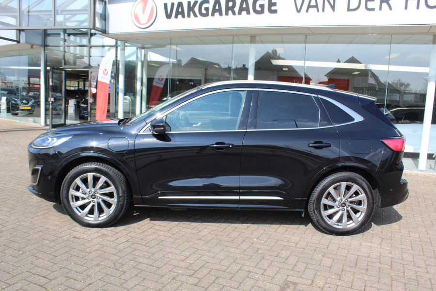 Ford Kuga 2.5-225pk PHEV 'Vignale' Plug-in Hybrid Automaat. Luxe hybride rijden voor een reëel bedrag ! Adaptieve Cruise Control, Climate Control, Stoel-, stuur-, voorraam- en achterbankverwarming, Side- en lane assist, Camera, Head-up display etc.