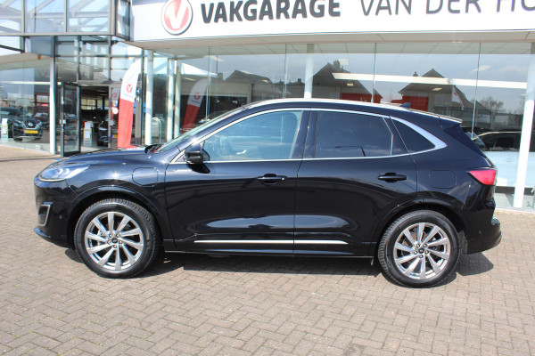 Ford Kuga 2.5-225pk PHEV 'Vignale' Plug-in Hybrid Automaat. Luxe hybride rijden voor een reëel bedrag ! Adaptieve Cruise Control, Climate Control, Stoel-, stuur-, voorraam- en achterbankverwarming, Side- en lane assist, Camera, Head-up display etc.