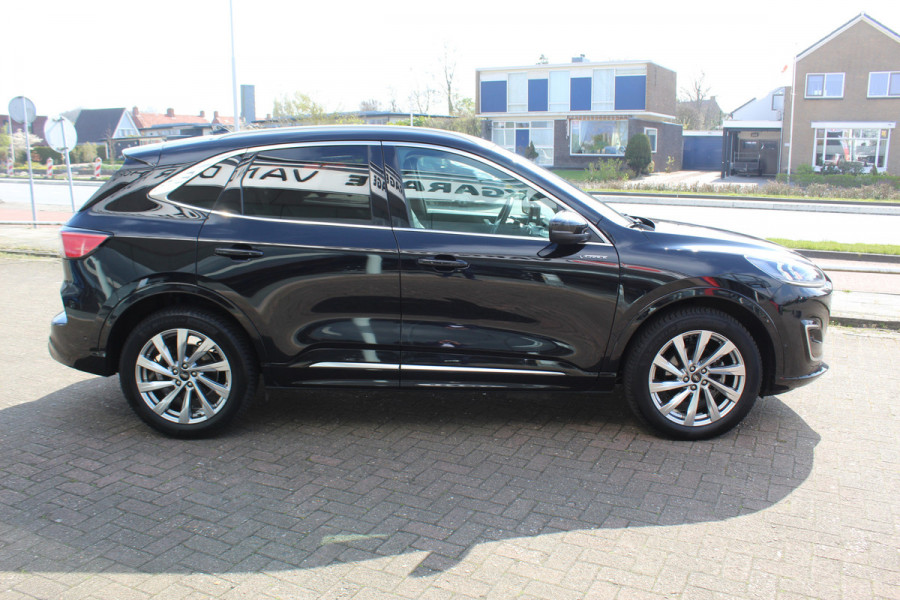 Ford Kuga 2.5-225pk PHEV 'Vignale' Plug-in Hybrid Automaat. Luxe hybride rijden voor een reëel bedrag ! Adaptieve Cruise Control, Climate Control, Stoel-, stuur-, voorraam- en achterbankverwarming, Side- en lane assist, Camera, Head-up display etc.