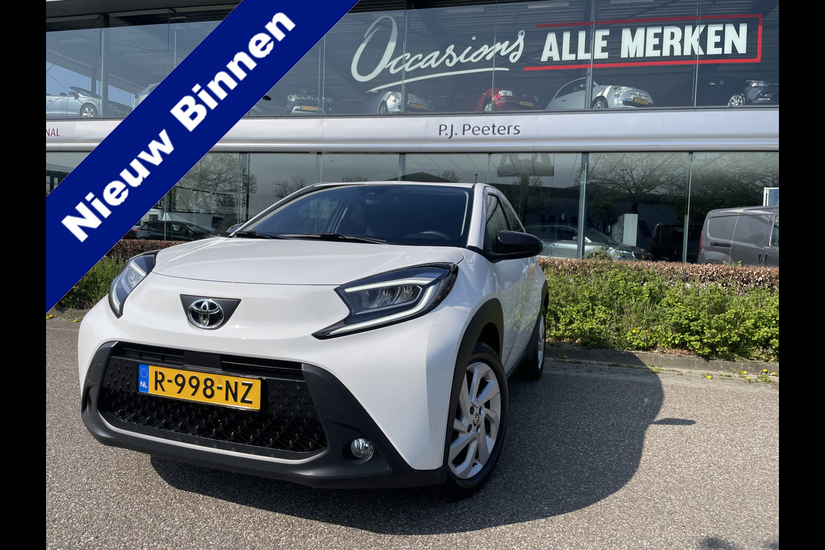 Toyota Aygo X 1.0 VVT-i MT first Achteruitrijcamera - Airco - Apple carplay - Bluetooth - Cruise control - Led verlichting -  Licht metalen velgen 17 inch - Radio - Mistlampen - Stuur multifunctioneel - Stuur leder - Elektrische ramen voor - Regensensor - Start/stop systeem