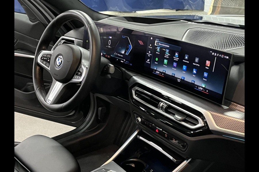 BMW 3-serie 330e M-pakket | Adapt. cruise | Open dak | Trekhaak | Head-up | Stoelverwarming | Sfeerverlichting | Carplay | Leder