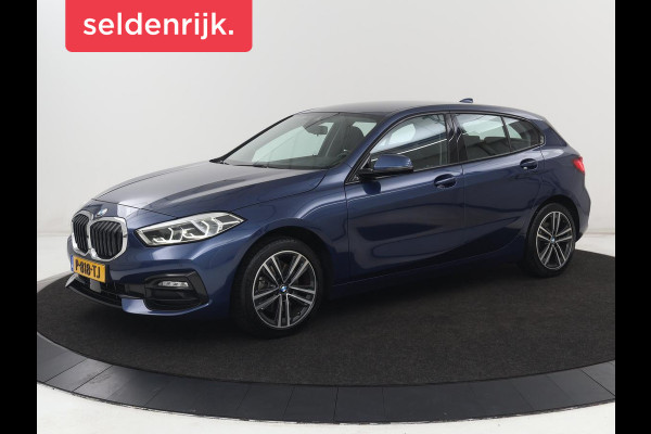 BMW 1-serie 118i Sport Line | Sportstoelen | Carplay | Half leder | Live Cockpit | Full LED | Navigatie | Sfeerverlichting | Trekhaak | Climate control | Parkeerhulp | Cruise control | DAB | Bluetooth