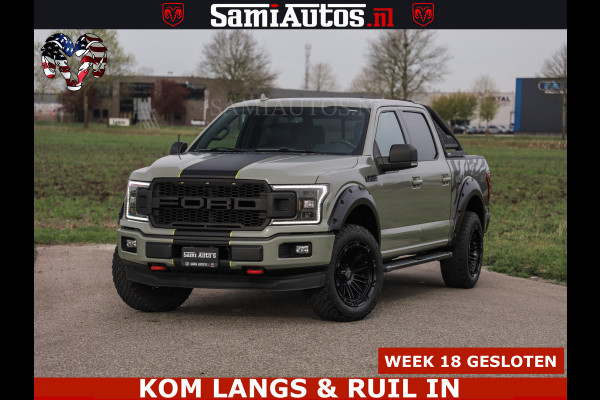 Ford USA F-150 5.0 V8 4X4 | MAT OLIVE GREEN | BIJTELLING VRIJ | ZEER DIK | CAMERA | 3500KG | PANORAMA | LEDER | GO RHINO ROLLBAR | CRUISE CONTROL | PRINS LPG | BAKFLIP COVER | Deze pick-up is leverbaar met zowel een groot rijbewijs (C) als een klein rijbewijs (B). Laat ons weten wat jouw voorkeur is.