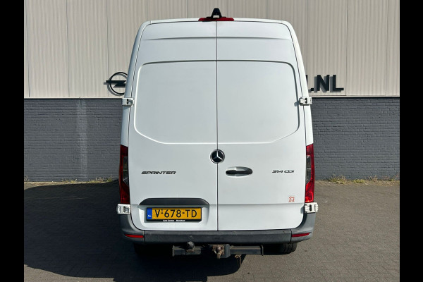 Mercedes-Benz Sprinter 314 2.2 CDI 143pk AUT-7 L2H2 EURO VI-D NAVI Camera ECC Keyless Bluetooth Navigatie-pakket Elektr.Spiegels+Verwarmd BlindSpot-Assist Regensensor Bordherkenning Trekhaak 3.500kg Trekvermogen Betonplex Wandbetimmerd