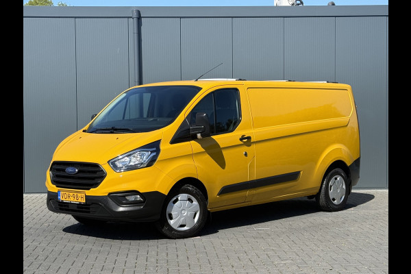 Ford Transit Custom 2.0 TDCI / L2H1 / 1e EIG. / AIRCO / CRUISE / 2.8 TONS TREKHAAK / STOELVERW / PDC / DAKDRAGERS