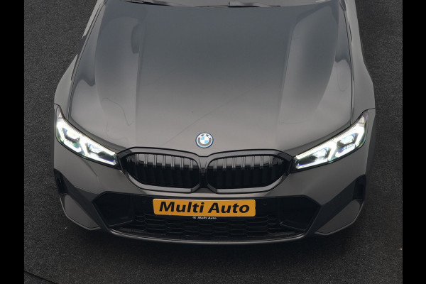 BMW 3 Serie Touring 330e M Sport FACELIFT PHEV 293pk Dealer O.H. | Trekhaak Af Fabriek | Panodak | Head Up | Camera | Dravitgrau | Lederen Sportstoelen Verwarmd | Sfeerverlichting | Apple Carplay | Keyless | Blis | Cruise Control | Navigatie | DAB | Plug In Hybrid |