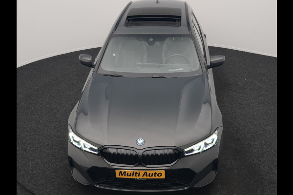 BMW 3 Serie Touring 330e M Sport FACELIFT PHEV 293pk Dealer O.H. | Trekhaak Af Fabriek | Panodak | Head Up | Camera | Dravitgrau | Lederen Sportstoelen Verwarmd | Sfeerverlichting | Apple Carplay | Keyless | Blis | Cruise Control | Navigatie | DAB | Plug In Hybrid |