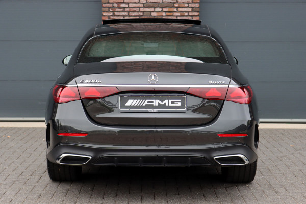 Mercedes-Benz E-Klasse 400 e 4MATIC AMG Line | Hyperscreen | Luchtvering | Achterasbesturing | Distronic+ | HUD | Massage | Burmester | Nappa Leder | Trekhaak | Vlakkenverwarming | Stoelventilatie | Soft-Close |
