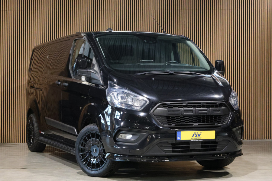 Ford Transit Custom 300 2.0 TDCI L2H1 Raptor Edition | Camera | CarPlay | Trekhaak | Stoelverwarming | Treeplanken | Spoilerkit | PDC V+A | Nieuwe APK