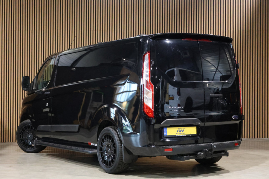 Ford Transit Custom 300 2.0 TDCI L2H1 Raptor Edition | Camera | CarPlay | Trekhaak | Stoelverwarming | Treeplanken | Spoilerkit | PDC V+A | Nieuwe APK