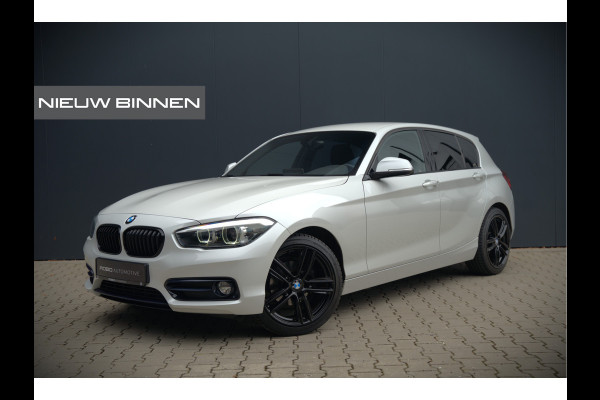 BMW 1-serie 118i Sport Line Edition | Stoelverwarming | Cruise Control | Parkeersensoren | Navigatie | Groot Scherm | Digitale Tellers | Automaat | Keyless | Trekhaak | LED