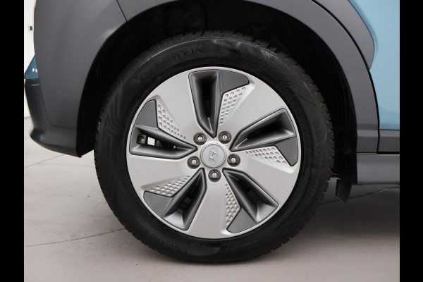 Hyundai Kona EV PREMIUM SKY 64 kWh 100% SOH *CERAMIC BLUE* + SCHUIFDAK | STOELVERW. V+A | STOELVENTILATIE | KRELL