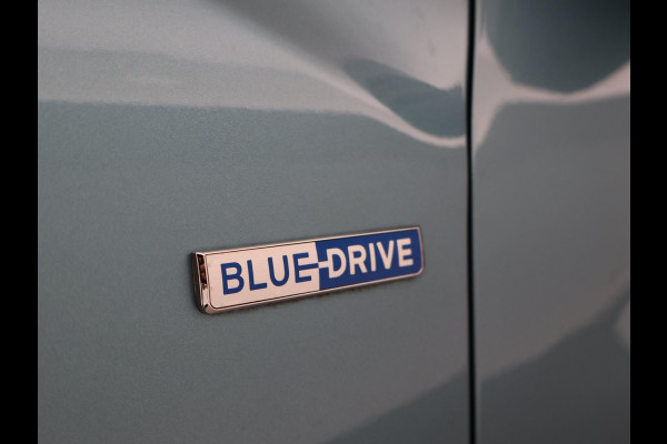 Hyundai Kona EV PREMIUM SKY 64 kWh 100% SOH *CERAMIC BLUE* + SCHUIFDAK | STOELVERW. V+A | STOELVENTILATIE | KRELL