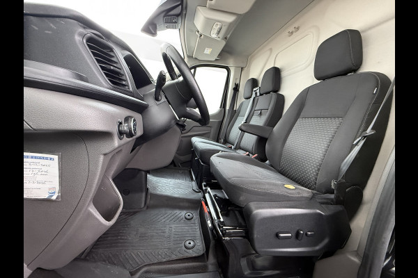 Ford Transit 310 2.0 TDCI L2H2 3-Persoons Camera Airco Stoelverwarming Elek.Stoel Cruise Control Pdc Lane Assist Trend Betonplex Vloer Wandbetimmering Schuifdeur Voorruitverwarming 1e Eigenaar Origineel Nederlandse Bus