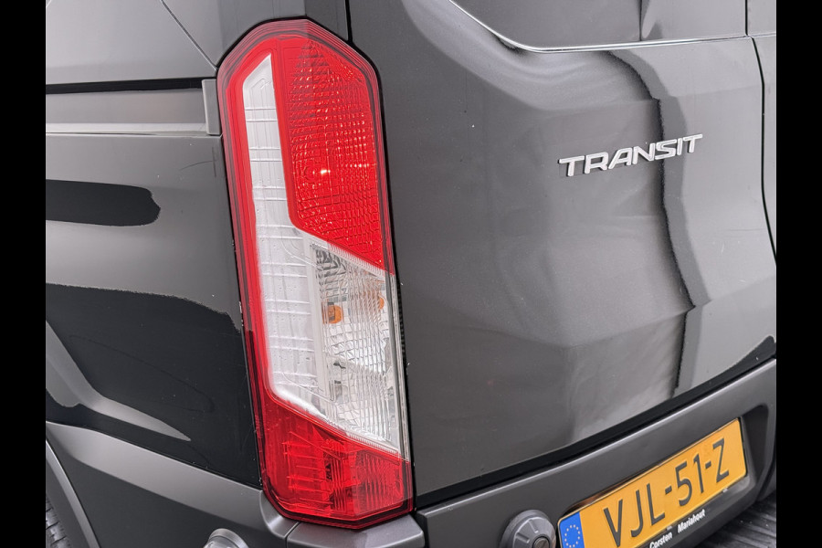 Ford Transit 310 2.0 TDCI L2H2 3-Persoons Camera Airco Stoelverwarming Elek.Stoel Cruise Control Pdc Lane Assist Trend Betonplex Vloer Wandbetimmering Schuifdeur Voorruitverwarming 1e Eigenaar Origineel Nederlandse Bus