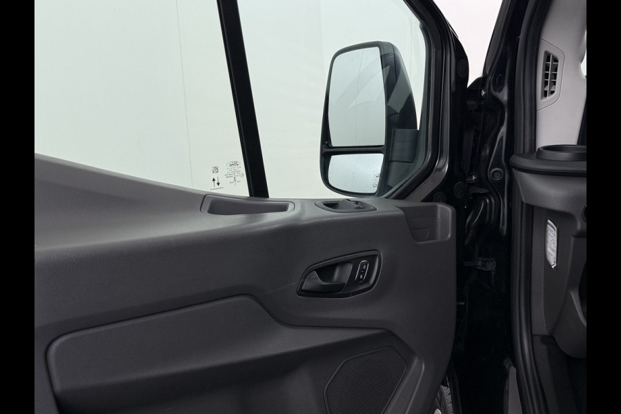 Ford Transit 310 2.0 TDCI L2H2 3-Persoons Camera Airco Stoelverwarming Elek.Stoel Cruise Control Pdc Lane Assist Trend Betonplex Vloer Wandbetimmering Schuifdeur Voorruitverwarming 1e Eigenaar Origineel Nederlandse Bus