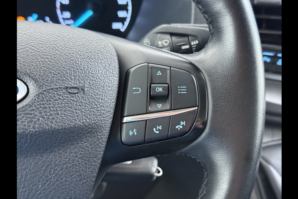 Ford Transit 310 2.0 TDCI L2H2 3-Persoons Camera Airco Stoelverwarming Elek.Stoel Cruise Control Pdc Lane Assist Trend Betonplex Vloer Wandbetimmering Schuifdeur Voorruitverwarming 1e Eigenaar Origineel Nederlandse Bus