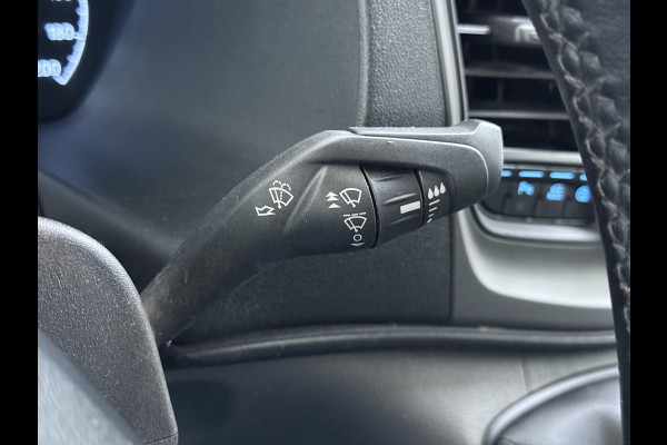 Ford Transit 310 2.0 TDCI L2H2 3-Persoons Camera Airco Stoelverwarming Elek.Stoel Cruise Control Pdc Lane Assist Trend Betonplex Vloer Wandbetimmering Schuifdeur Voorruitverwarming 1e Eigenaar Origineel Nederlandse Bus
