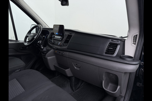 Ford Transit 310 2.0 TDCI L2H2 3-Persoons Camera Airco Stoelverwarming Elek.Stoel Cruise Control Pdc Lane Assist Trend Betonplex Vloer Wandbetimmering Schuifdeur Voorruitverwarming 1e Eigenaar Origineel Nederlandse Bus