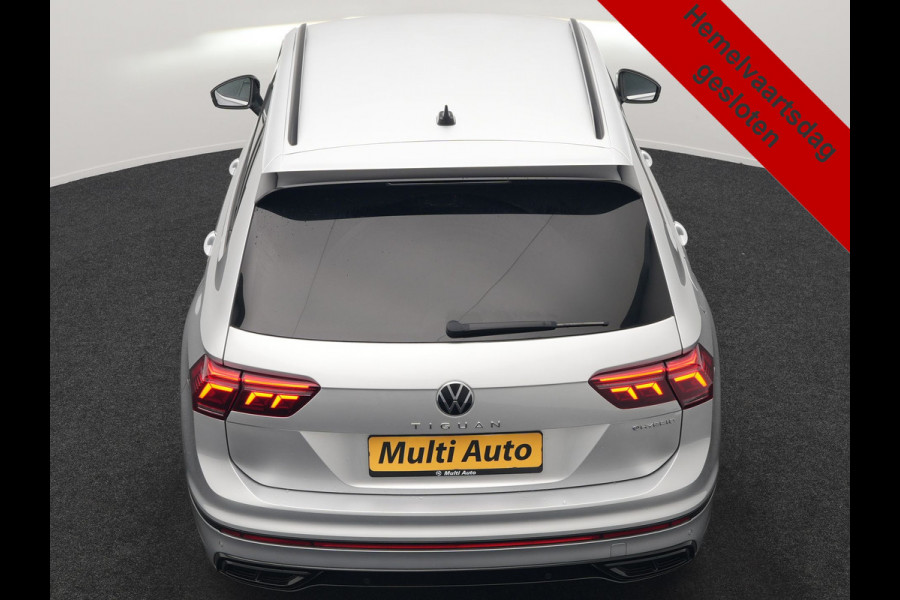 Volkswagen Tiguan 1.4 TSI eHybrid R-Line PHEV 245pk Dealer O.H | Trekhaak Af Fabriek | Adaptive Cruise | IQ Light | Adaptive Onderstel | Camera | Alcantara Sportstoelen & Stuur Verwarmd | Blis | Keyless | Sfeerverlichting | Virtual | Navigatie | DAB | 20"L.M | Plug In Hybrid |