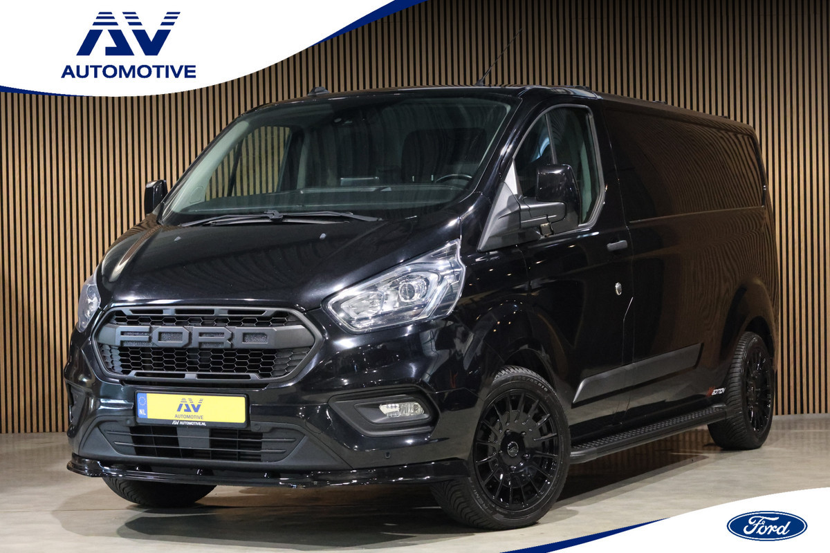 Ford Transit Custom 300 2.0 TDCI L2H1 Raptor Edition | Camera | CarPlay | Trekhaak | Stoelverwarming | Treeplanken | Spoilerkit | PDC V+A | Nieuwe APK