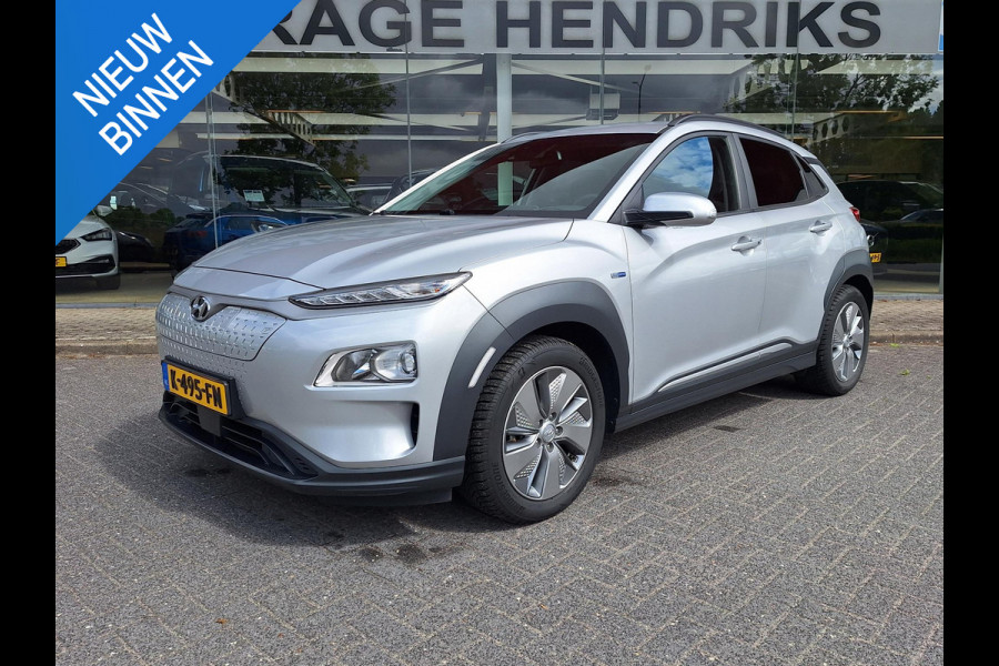 Hyundai Kona EV Fashion 64 kWh | SOH: nnb | 3 fase | Warmtepomp | Trekhaak | Camera | Adaptive CC | Blindspot |