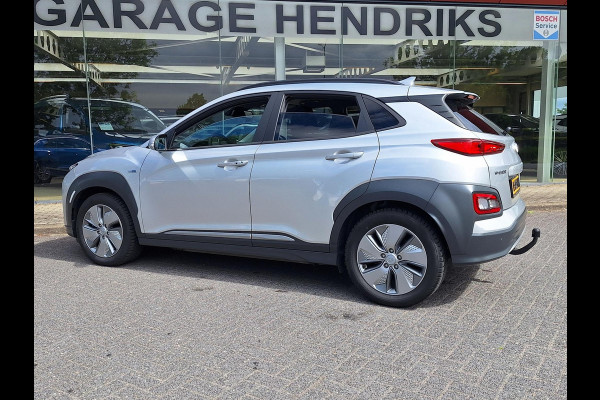 Hyundai Kona EV Fashion 64 kWh | SOH: nnb | 3 fase | Warmtepomp | Trekhaak | Camera | Adaptive CC | Blindspot |