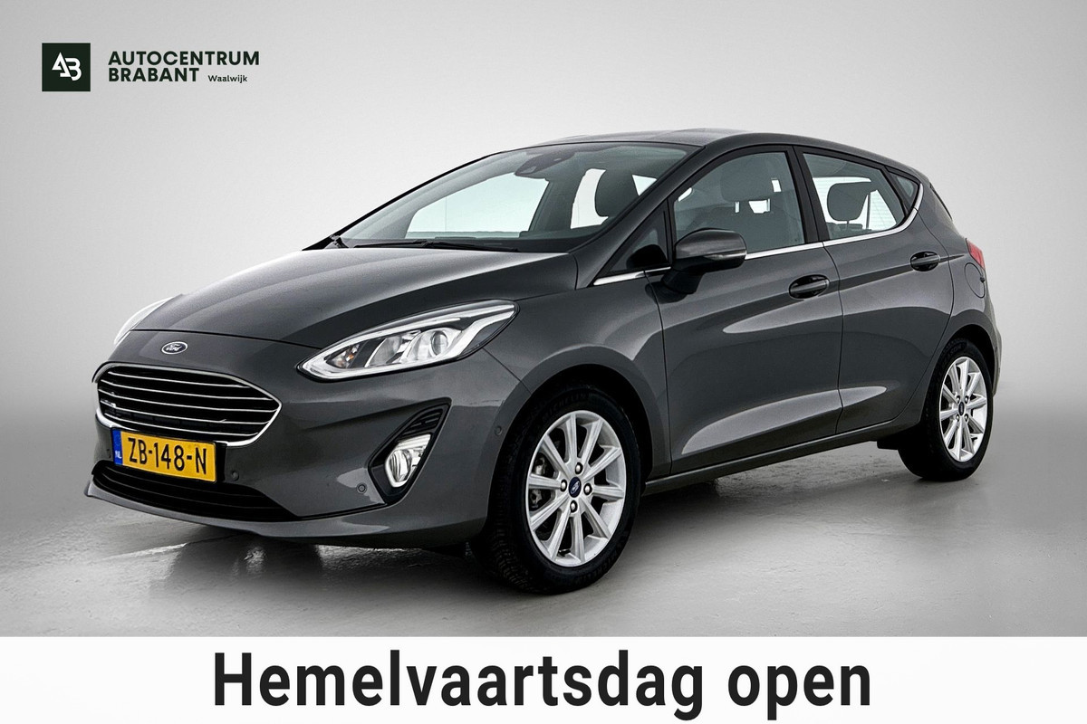 Ford Fiesta 1.0 EcoBoost Titanium (NAVIGATIE, CARPLAY, PARKEERSENSOREN, LED, STUURBEDIENING, 1e EIGENAAR, GOED ONDERHOUDEN)