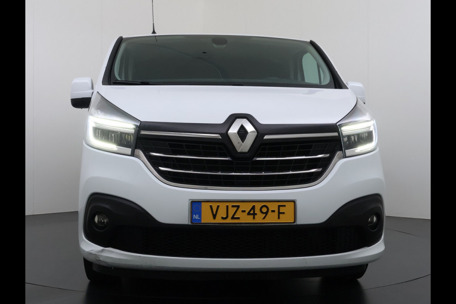Renault Trafic 2.0 dCi 120 T29 L2H1 Dubbele Cabine Trekhaak Camera Navi Ecc Cruise Control Pdc DAB Business Euro 6 Betonplex Vloer Wandbetimmering Regen-Lichtsensor 2.000kg Trekgewicht 1e Eigenaar 5-Persoons