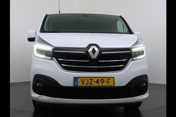Renault Trafic 2.0 dCi 120 T29 L2H1 Dubbele Cabine Trekhaak Camera Navi Ecc Cruise Control Pdc DAB Business Euro 6 Betonplex Vloer Wandbetimmering Regen-Lichtsensor 2.000kg Trekgewicht 1e Eigenaar 5-Persoons