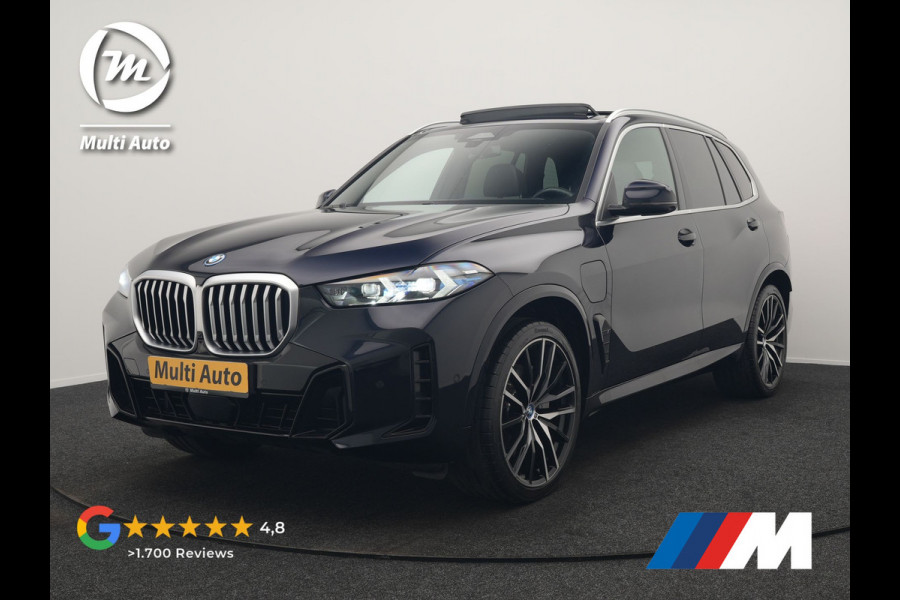 BMW X5 xDrive50e M Sport PHEV 490pk Dealer O.H. | Panodak Sky Lounge | Luchtvering | Head Up | 360 Camera | Harman / Kardon | Nappa Lederen Comfortstoelen Memory & Verwarmd | Carbon Schwarz | Apple Carplay | Keyless | Blis | 22"L.M | Plug In Hybrid |