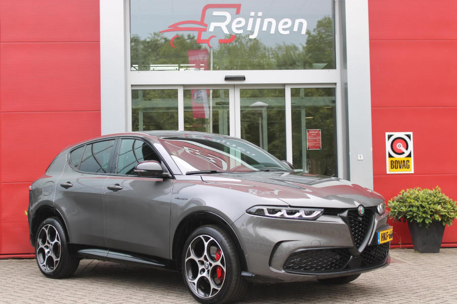 Alfa Romeo Tonale 1.5T Hybrid 160PK VELOCE | PREMIUM PACK: LEDEREN BEKLEDING/GEVENTILEERDE VOORSTOELEN/4-VOUDIG ELEKTRISCH VERSTELBARE LENDESTEUN VOORSTOELEN/ELEKTRISCH BEDIENBARE /HOOGGLANS ZWARTE RAAMOMLIJSTING/AMBIENT LIGHTING | TECHNOLOGY PACK: PARKEERWAARSCHUWING VOOR EN ACHTER/360° CAMERA/AUTOMATISCH INPARKEREN/ AUTONOMOUS DRIVING LEVEL 2: ADAPTIVE CRUISE CONTROL/LANE CENTERING ASSIST/TRAFFIC JAM ASSIST DODEHOEK DETECTIE AUTOMATISCH DIMMENDE BUITENSPIEGELS ELEKTRISCH BEDIENBARE ACHTERKLEP | WINTERPACK: STOELVERWARMING VOOR/STUURVERWARMING/VERWARMBARE RUITENSPROEIERS | 19" LICHTMET