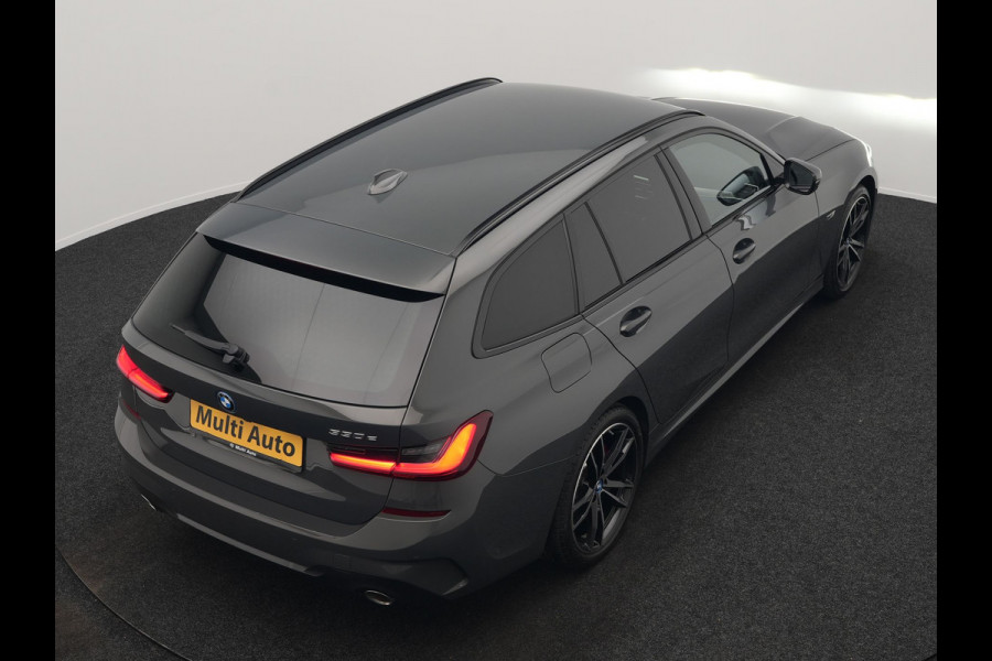 BMW 3 Serie Touring 330e M Sport PHEV 293pk Dealer O.H. Dravitgrau | Head Up | Camera | Laser LED | Sfeerverlichting | Lederen Sportstoelen & Stuur Verwarmd | Apple Carplay | Keyless | Blis | 19"L.M | Virtual | Navigatie | DAB | Plug In Hybrid |