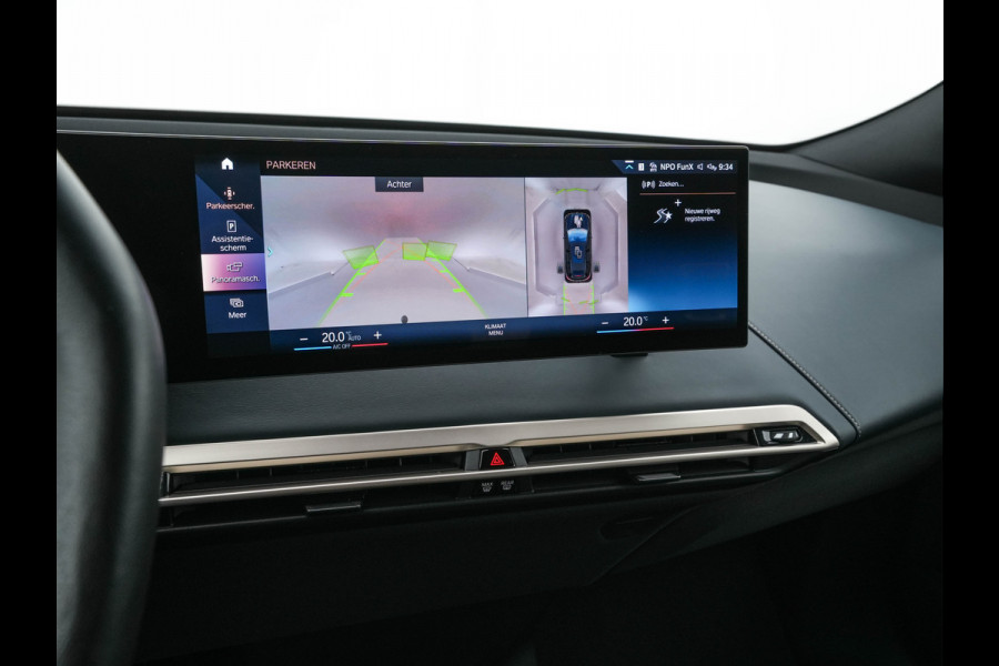 BMW iX xDrive40 High Executive 77 kWh [ 3-Fase ] (INCL-BTW) *PANO | HEAD-UP | SOFT-CLOSE | LEATHER | TOPVIEW | FULL-LED | MEMORY-PACK | HARMAN/KARDON | BLINDSPOT | WIDESCREEN-COCKPIT | HEATED-COMFORTSEATS | DAB | AMBIENTLIGHT | TOWBAR | 22'