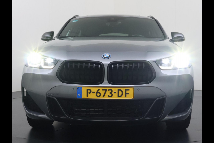 BMW X2 xDrive25e M SPORT Business Edition Plus VAN: 31.900,- VOOR: 29.330,- UW WKVOORDEEL: 2.570,- | BOMVOL | PHEV| PANO| NAP| STOEL + STUURVERWARMING| COMFORT ACCESS| ELEK. ACHTERKLEP| AFNEEMBARE TREKHAAK| HUD| ACHTERUITRIJCAMERA| APPLE CARPLAY