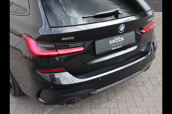 BMW 3 Serie Touring 320e xDrive High Executive M Sport Pakket Automaat / Live Cockpit Professional / Adaptief M Onderstel / Panoramadak / Stoelverwarming / Extra Getint Glas / LED / 19 Inch / Hifi / Lichtpakket